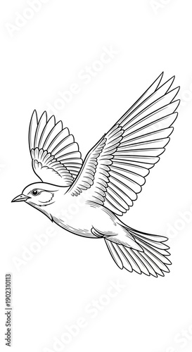 A man holding a remote control in his hands, standing and looking at it with a slight smile