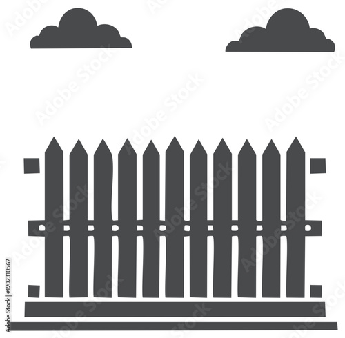 Silhouette of a wooden picket fence with two clouds in the sky.