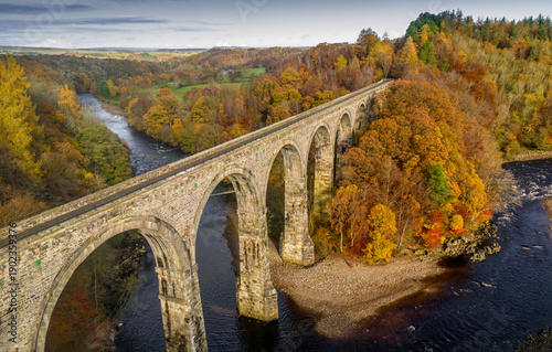 Lambley Viaduct straddling the River South Tyne in Northumberland, on a clear day in Autumn, taken by drone
