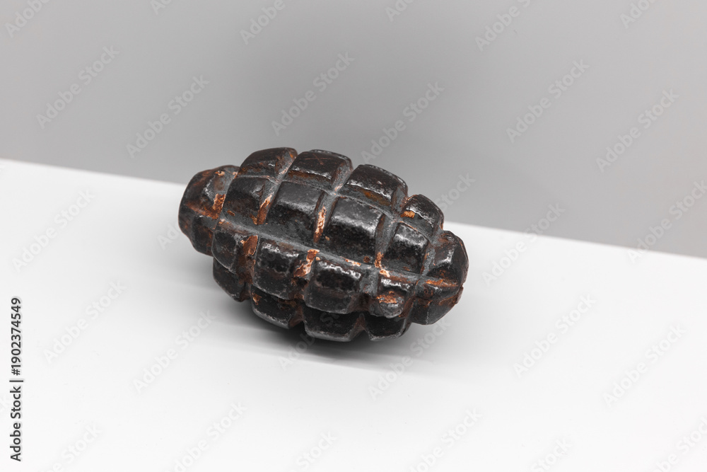 Naklejka premium Soviet F-1 hand grenade is on white shelf