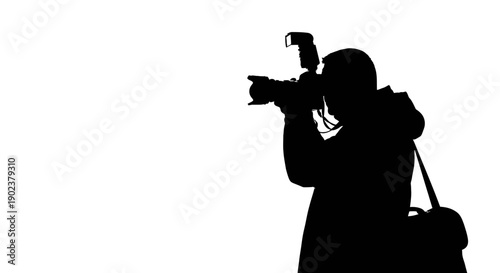 Silhouette of photographer taking picture with camera