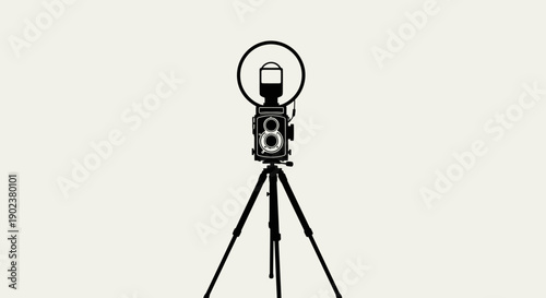 Vintage camera on tripod with flash for photography