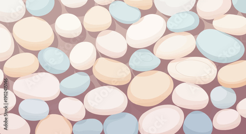 Smooth, rounded stones in muted pastel colors form a decorative pattern