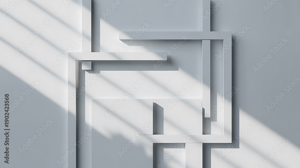 Obraz premium Overlapping white geometric frames on monochromatic wall creating intricate shadows pattern