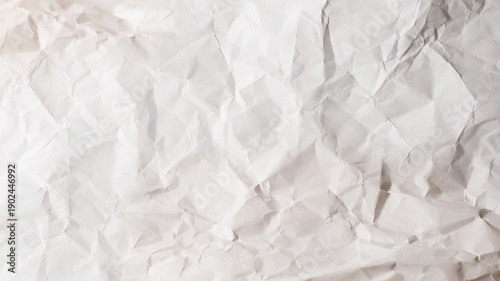 Crumpled white paper background.