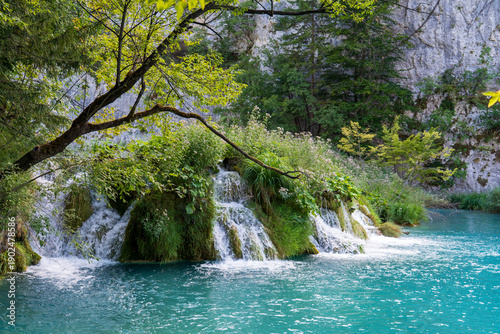 Fényképezés Plitvice Lakes, Croatia - August 16, 2025: Scenic landscape of turquoise lakes and waterfalls in National Park