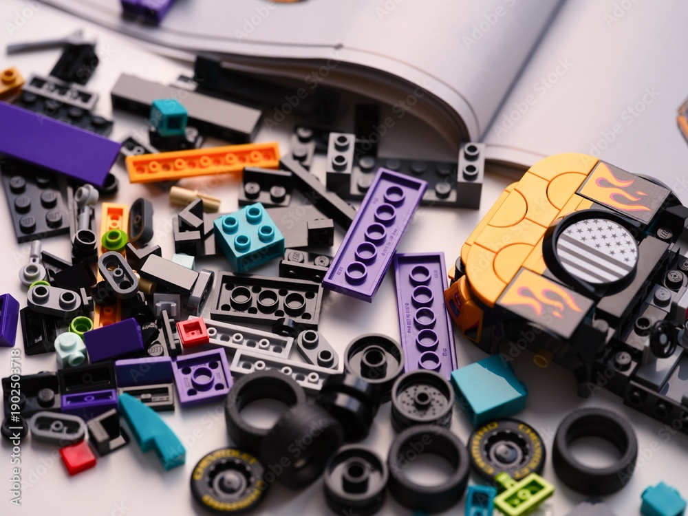 Fototapeta premium Tambov, Russian Federation - January 01, 2026 Lego Speed Champions Nascar Next Gen Chevrolet Camaro car kit build in progress with bricks, pieces and instructions