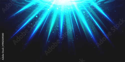 Abstract glowing blue light rays shining down from above with sparkling particles on a dark background, dynamic energy effect.
