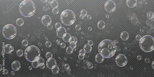Floating transparent bubbles against a dark gray background creating a light and airy texture