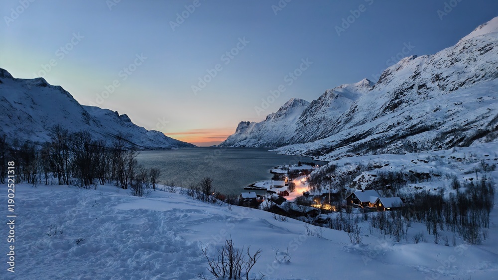 Fototapeta premium Winter Twilight over a Snowy Fjord Village