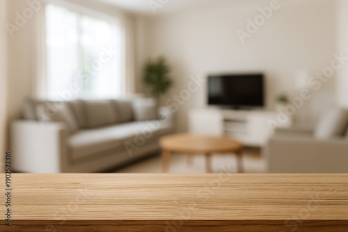 wooden top table with blurry background living room and kitchen set area