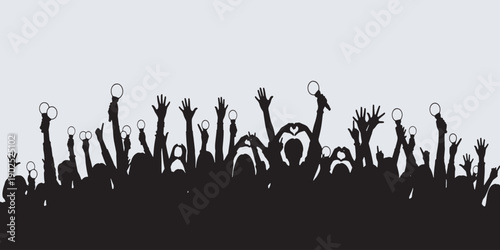 Silhouette of a cheering crowd with hands raised at a concert or event, celebrating and enjoying the moment.