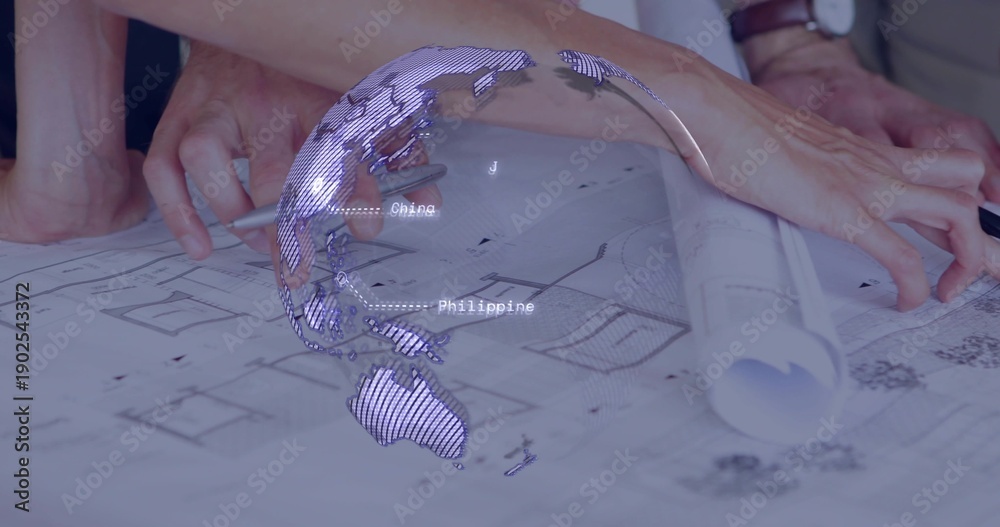 Obraz premium Pointing two hands in rolled sleeves tracing plans on studio table, with rolled plan, digital globe