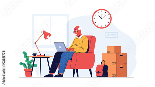 Senior man sitting in an armchair and using a laptop computer at home with cardboard boxes and a clock in the room.
