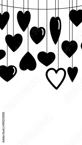 Black hearts hanging on strings against white background  