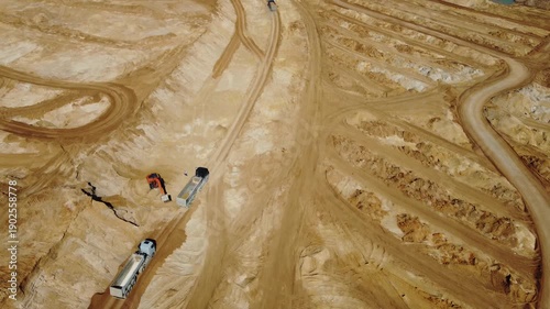 Drone flight over a large sand pit where construction sand is being mined
