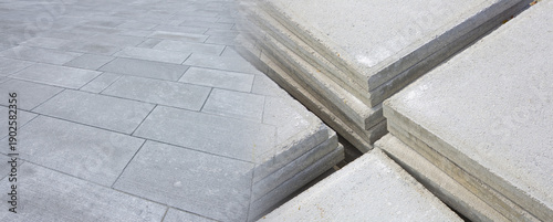 Fotografija NEW PAVING WITH STONE AND CONCRETE BLOCKS, CONSTRUCTION SITE SURFACE WITH CONCRE