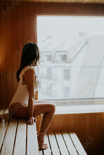 Woman enjoys time in a saun...