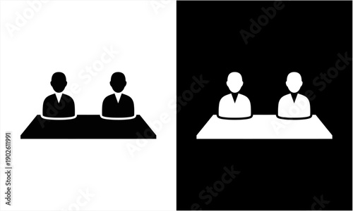 Two people sitting at a table, black and white icon illustration.