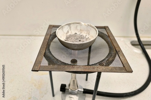 Evaporation of a ceramic dish containing silver granules, previously obtained by a separation method.