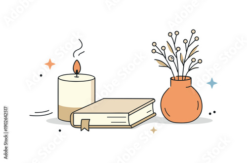 Minimal winter still life. Neutral-toned objects placed neatly on a surface, such as a book, candle, and dried plant, expressing warmth