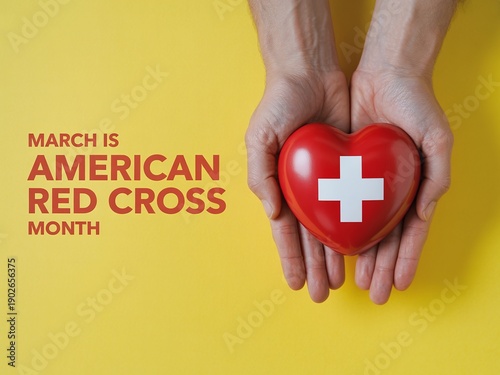 March is American Red Cross Month Announcement with Adult Hands Holding a Red Heart Symbol for Nonprofit Charity and Blood Donation Drive