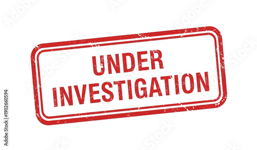 A red rubber stamp with the words under investigation