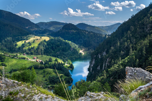 Spajicko Lake on Tara mountain surrounded by mountain peaks. Beautiful nature in western Serbia.