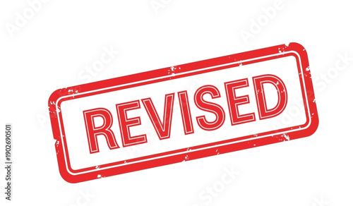 Red rubber stamp with the word revised on for editing purposes