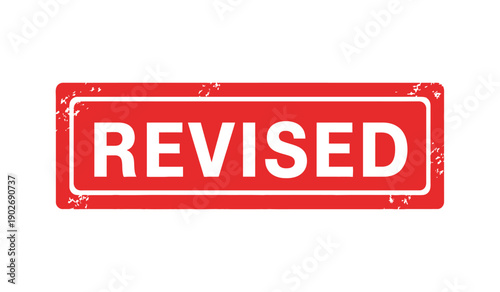 A red rubber stamp with the word revised in white letters