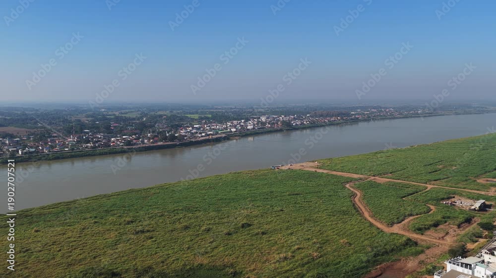 custom made wallpaper toronto digitalUrban landscape of Vientiane, Laos with traditional buddhist temples, modern buildings, and Mekong river background