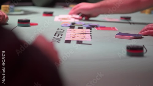 Close up view of two cards during a Texas hold 'Em poker game with defocused background