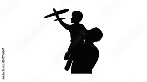 Silhouette of man lifting child playing with toy plane