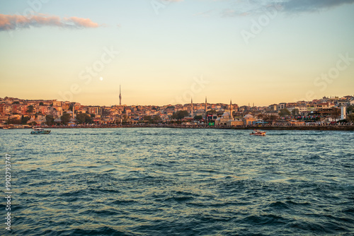 Schilderij op canvas Golden-hour view across Bosphorus toward Uskudar waterfront, Istanbul, Turkey wi