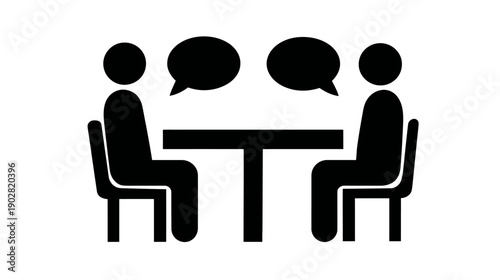 Communication icon: Two abstract figures with speech bubbles sitting at a table, symbolizing discussion, conversation, meeting, or interview