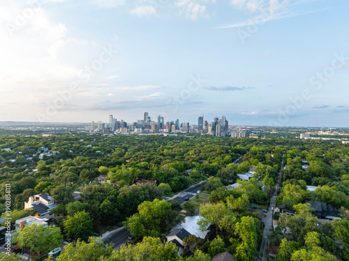 фотографія Aerial perspective of Austin, Texas skyline emerging above a verdant tree cover