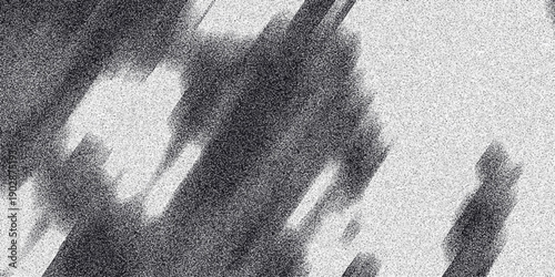 Dynamic abstract background in grayscale with sharp diagonal streaks and a fine granular texture creating a sense of speed and energy