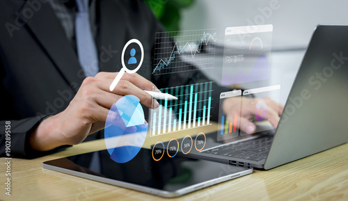 Business analyst analyzing rapidly changing data trends on laptop for strategic decision making, market insights, competitive advantage, and business success in a dynamic digital economy.