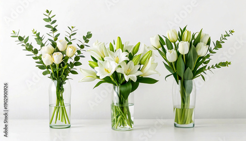 Elegant White Floral Arrangements in Glass Vases