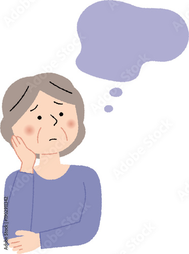 考え事をしているシニア女性