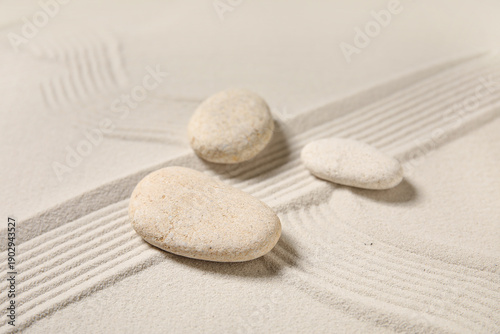 Canvas Print Composition with spa stones and lines on sand as background, closeup