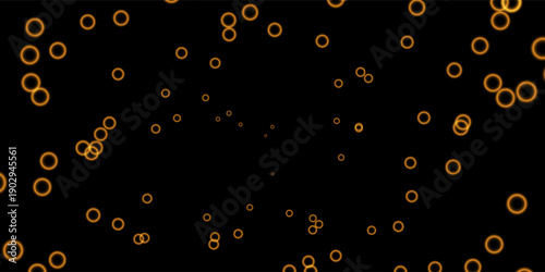 Abstract background featuring glowing orange rings floating on a dark black backdrop. The circular light particles create a futuristic and dynamic atmosphere
