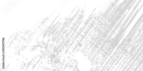 Abstract background with diagonal gray brush strokes and scattered dark particles on a white surface.