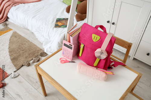 Pink backpack with headphon...