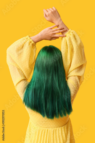 Young woman with green hair...