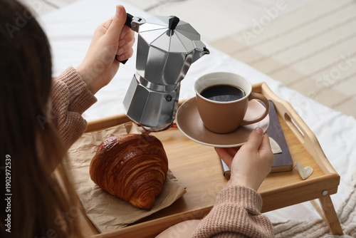 Young woman with cup of esp...