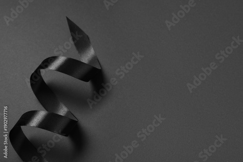Black silk ribbon on grey b...