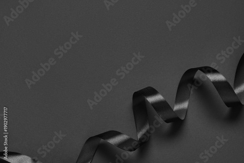 Black silk ribbon on grey b...