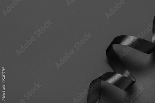 Black silk ribbon on grey b...