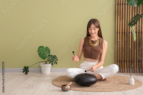 Meditating young woman play...